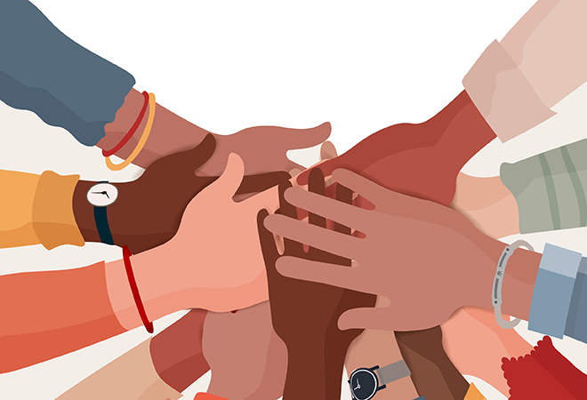 A decorative illustration with a diverse selection of hands overlapping, depicting a team or community rallying together.